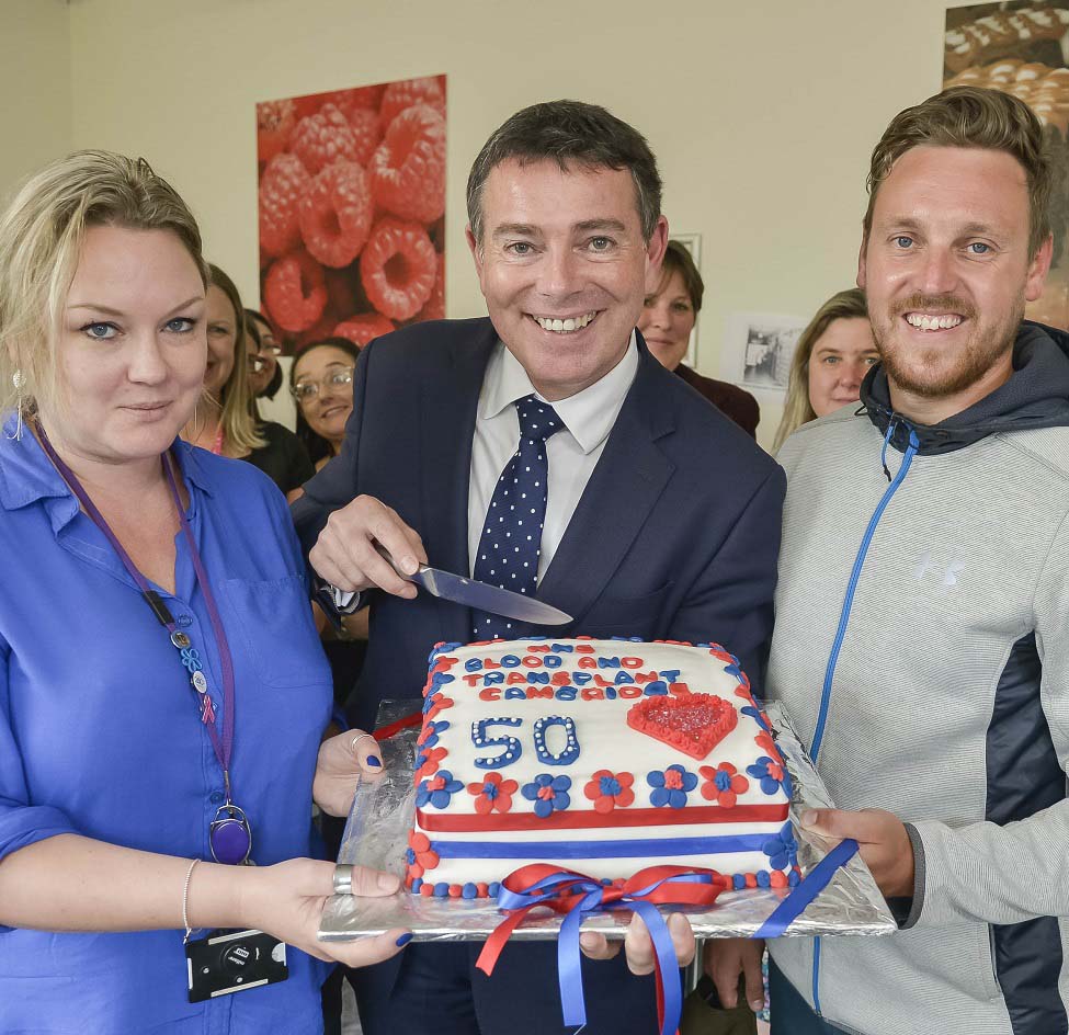 NHSBT Chief Executive, Ian Trenholm, holding the anniversary cake