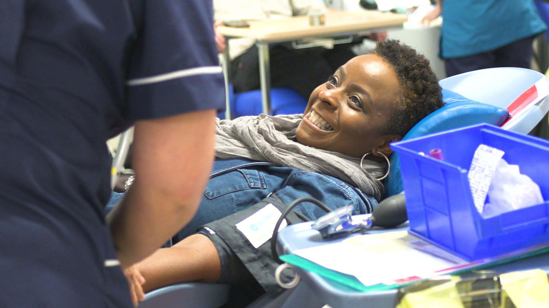 Faith leader Donna Akodu giving blood