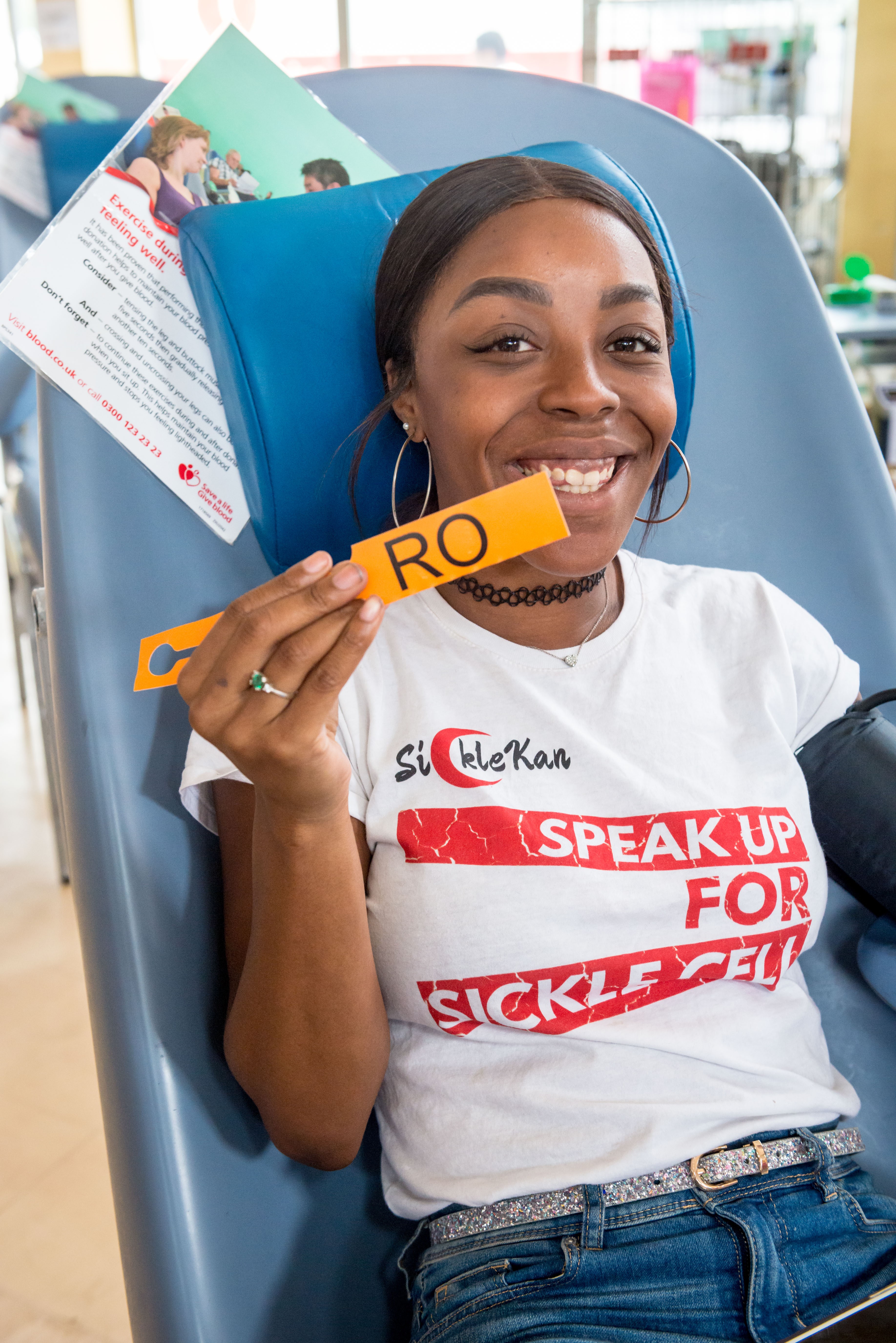 A donor holds an Ro blood bag tag