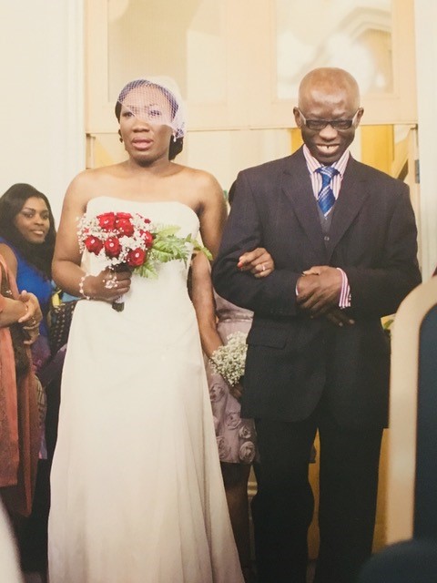 Henry walks his daughter Ebuzo down the aisle on her wedding day
