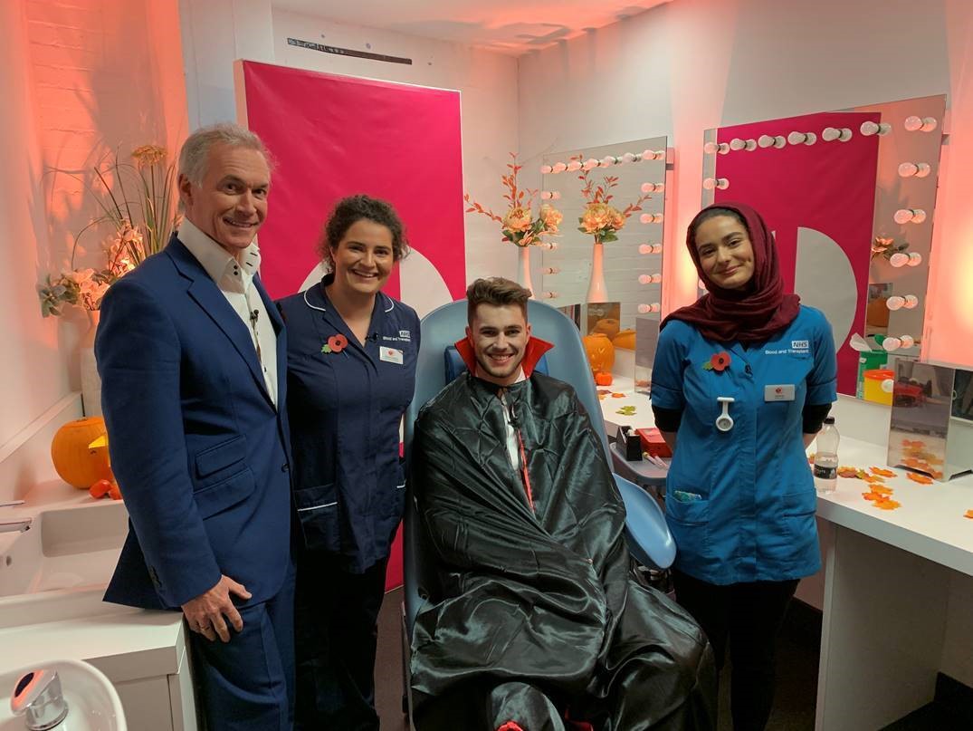Curtis, dressed as a vampire, with Dr Hilary Jones, a nurse and a donor carer