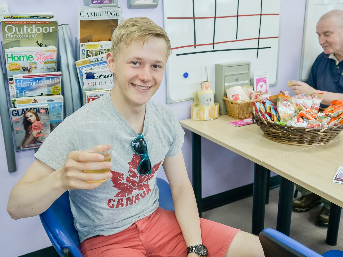 A young male donor has a pint of squash after giving blood