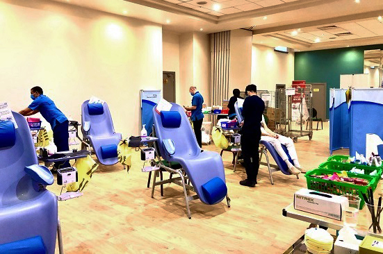 Donor carers set up the donation chairs