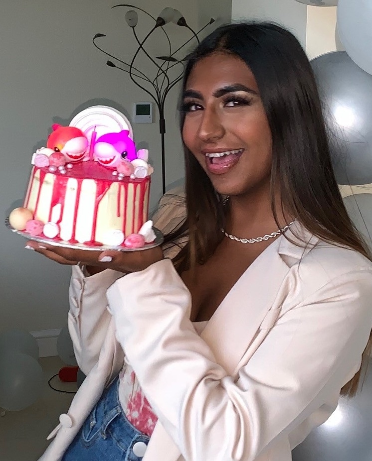 Alisha, holding a birthday cake
