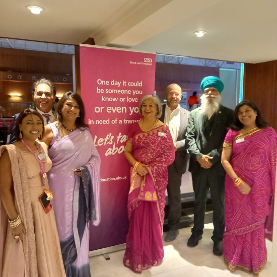 A group of attendees wear pink at an organ donation event organised with Khalsa Aid.