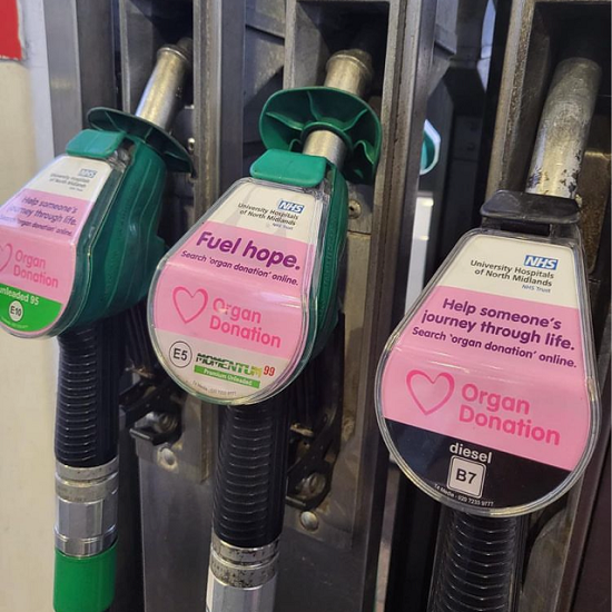 Pink petrol pumps in Stoke, displaying a "Fuel hope" message in support of Organ Donation Week