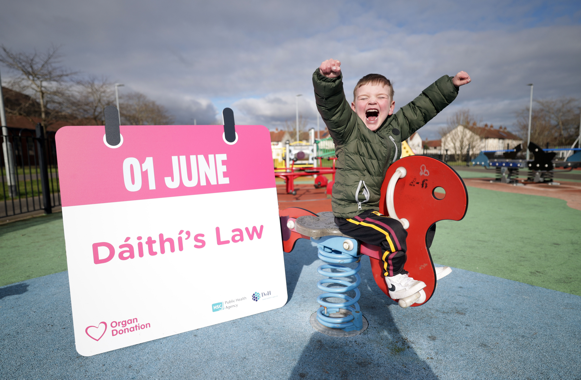 Dáithí at the playground with graphic of Dáithí’s Law dated 1 June 2023