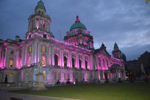 Belfast city hall lit up pink