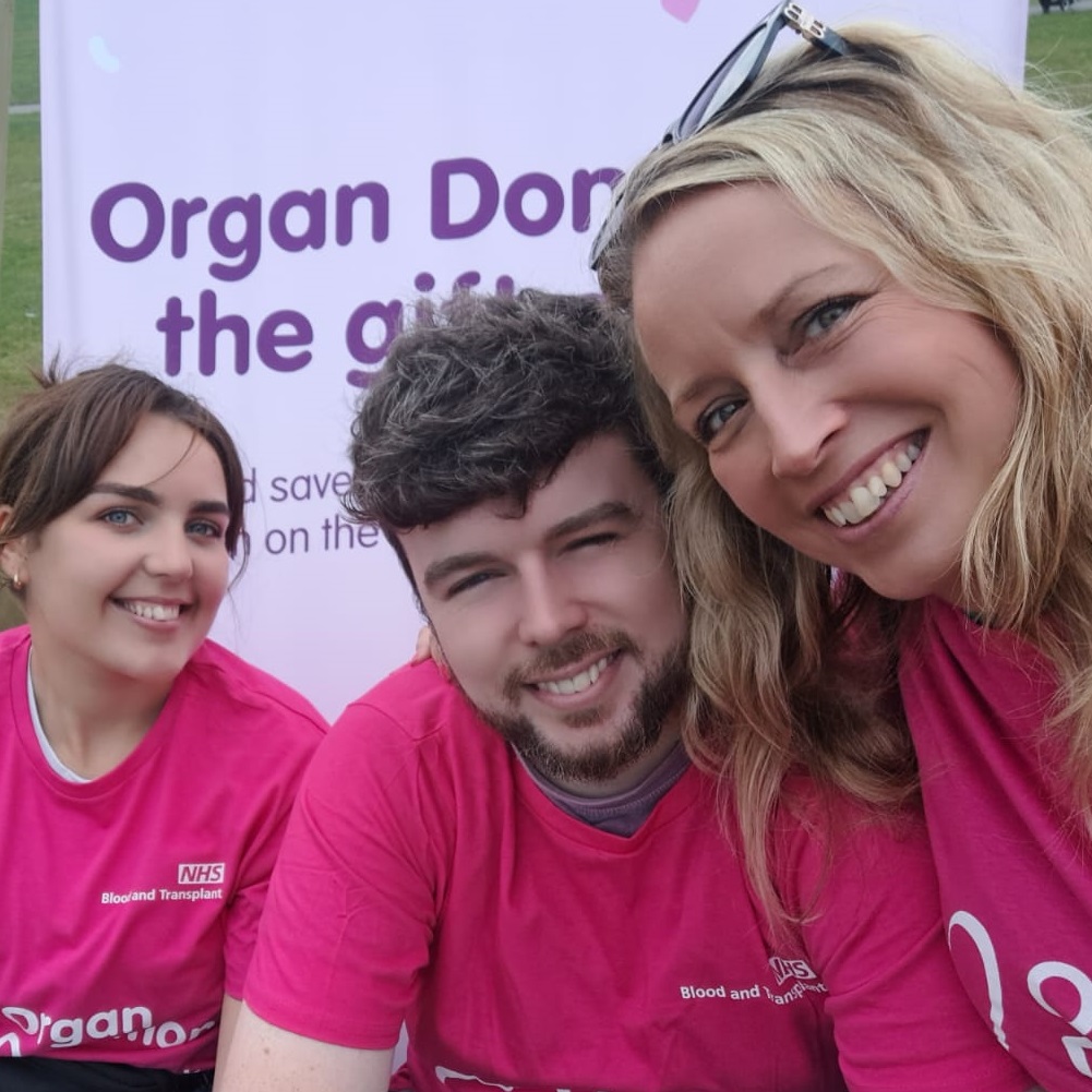 An image of organ donation supporters wearing pink at an event in Leicester's Abbey Park
