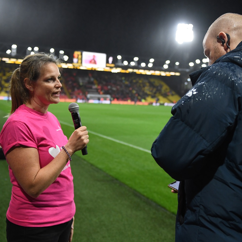 Specialist Nurse Becky being interviewed on the football pitch as Watford played West Brom in the Championship