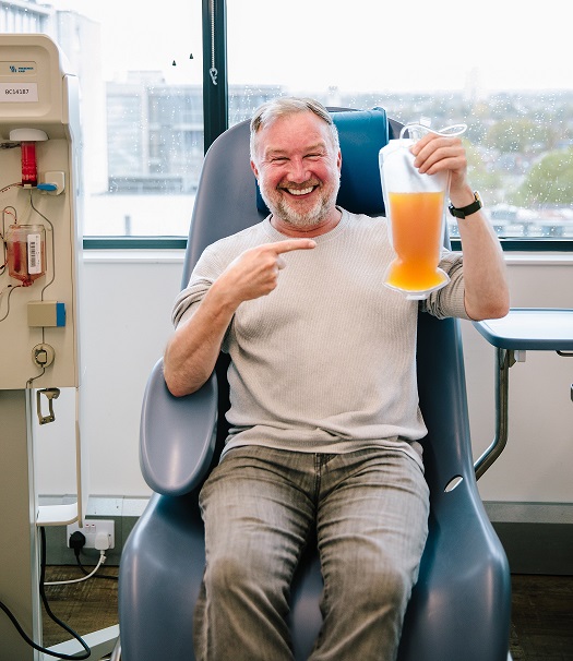 Donor holding a bag of platelets