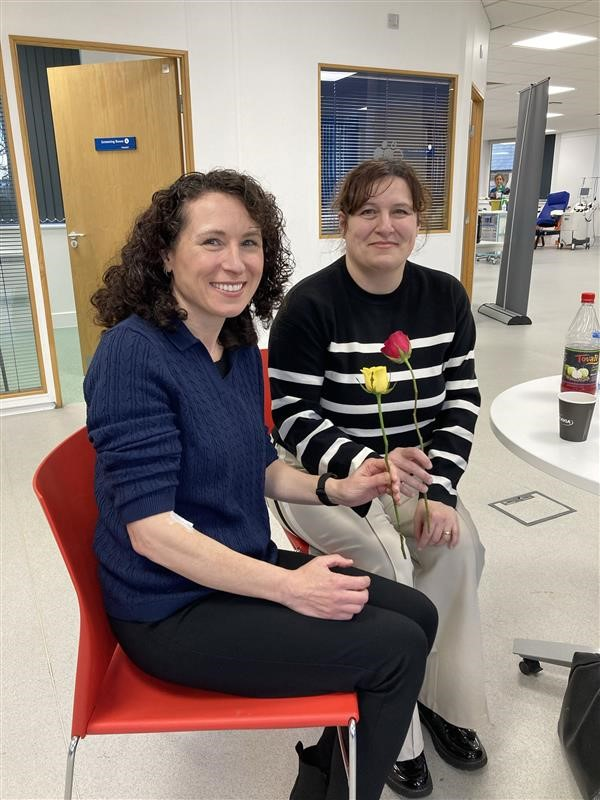Debbie and Tracey post-donation, holding their yellow (for platelets) and red (for blood) roses at Birmingham donor centre.