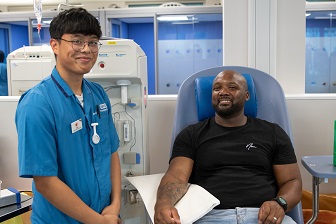 Plasma donor with NHSBT staff member