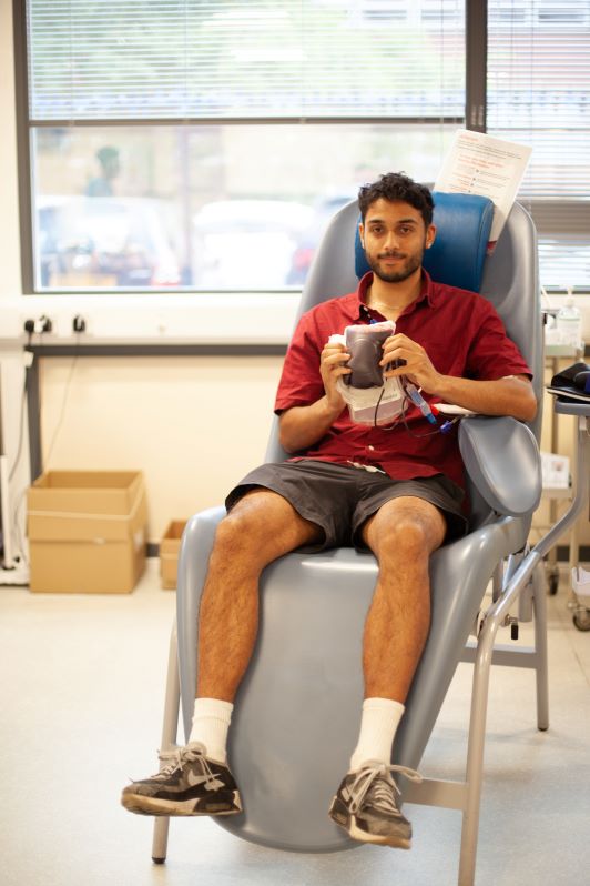 A donor holding a blood bag