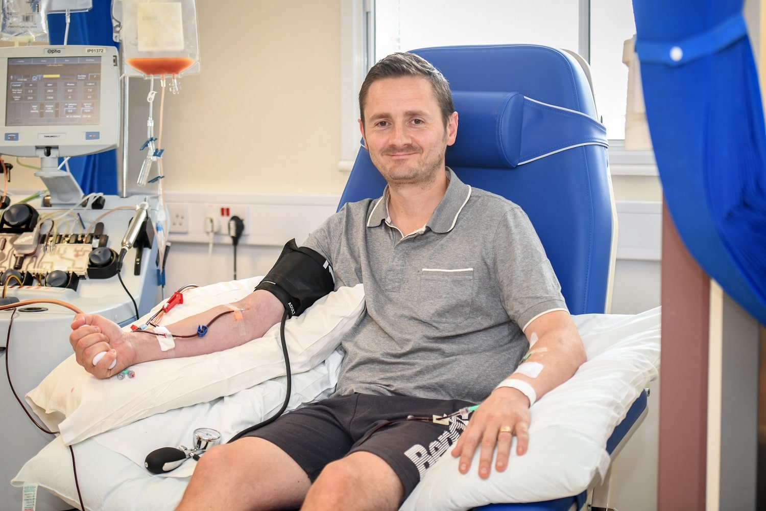 Donor donating stem cells in chair smiling