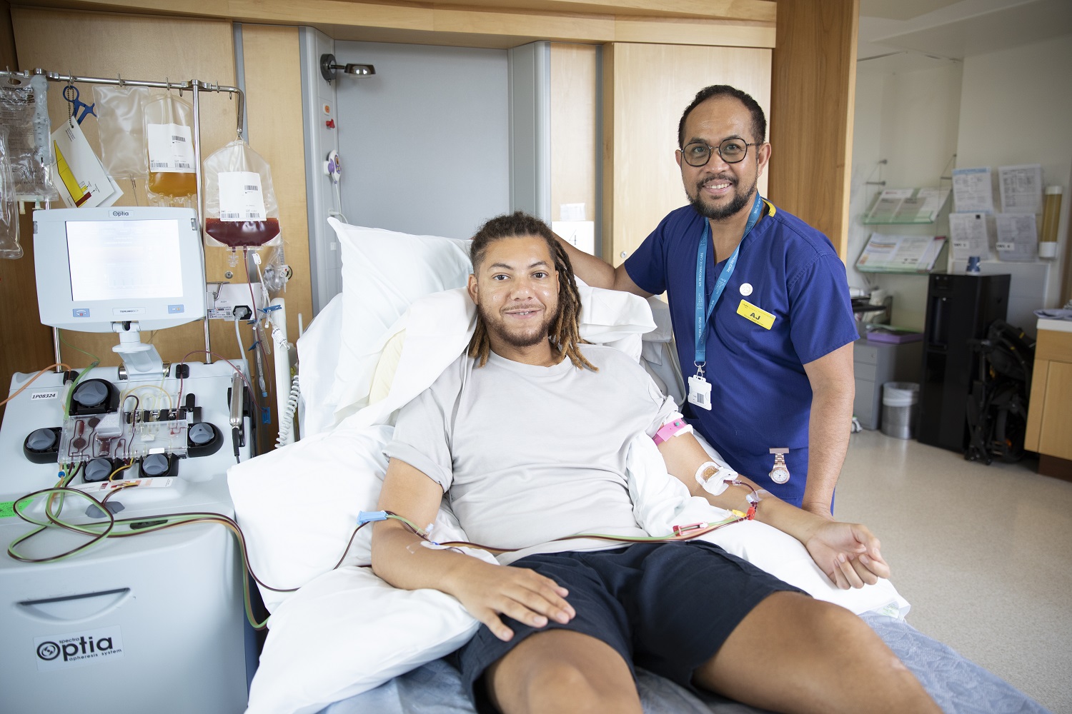 Stem cell donor and staff looking at camera and smiling