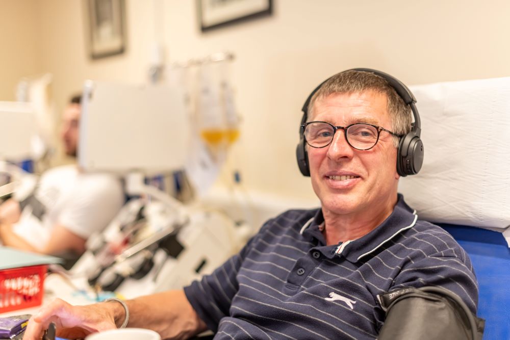 Donor with headphones on during platelets donation