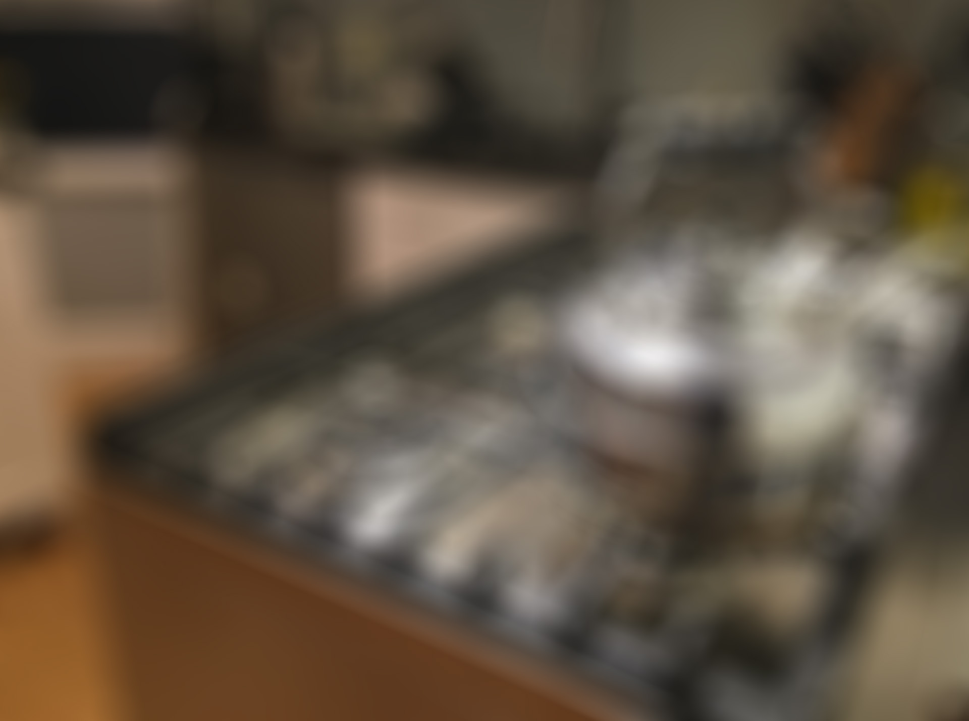 A blurred image of a kitchen worktop, a kettle is placed on a gas stove. The blurred image is similar to what someone with the eye condition keratoconus may see.