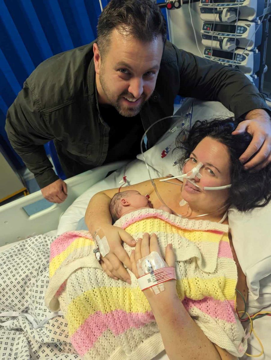 Adele with her husband and baby Jasmine after she woke from a coma