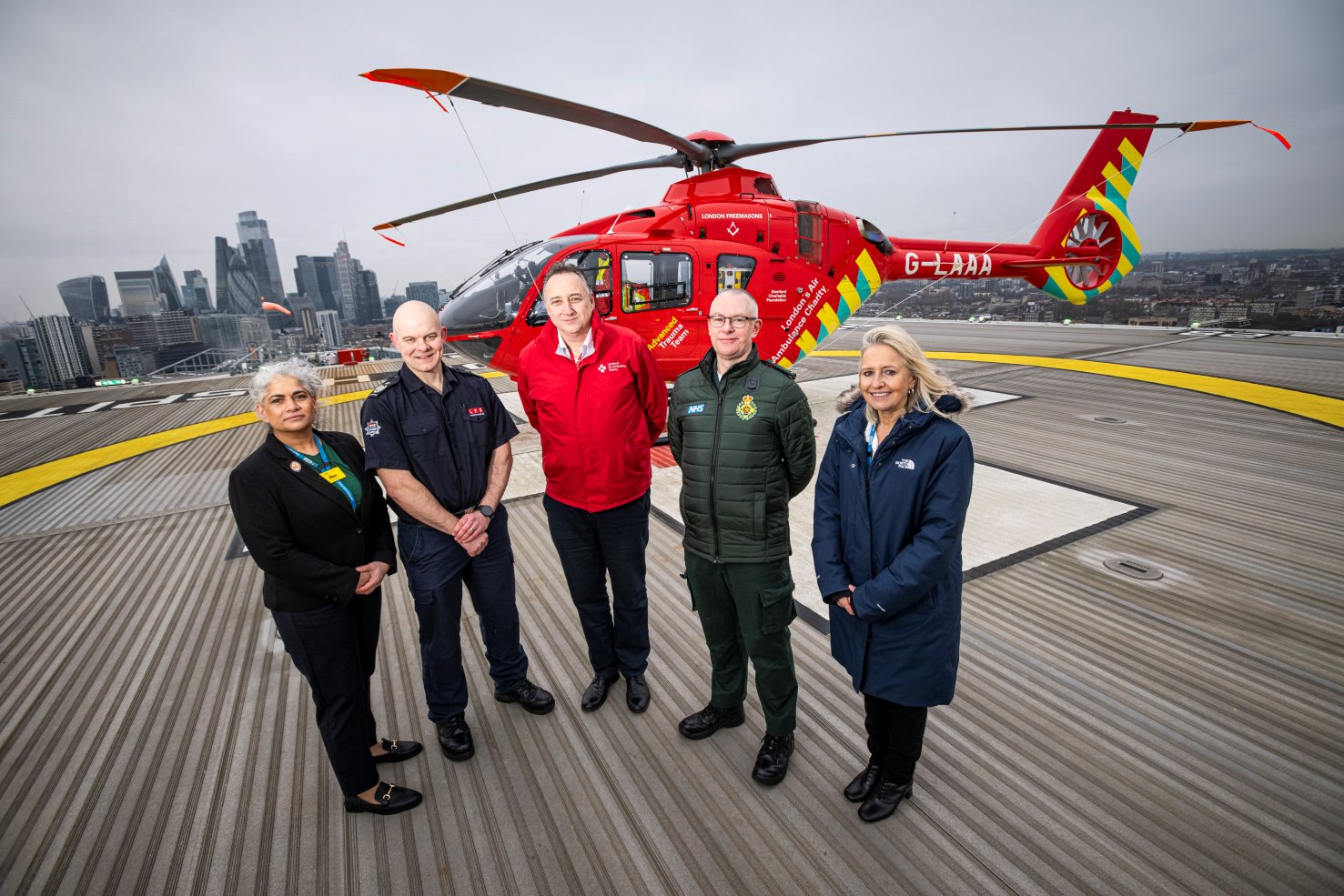 Dee Thiruchelvam, Chief Nursing Officer at NHS Blood and Transplant, Jonathan Smith, Deputy Commissioner for London Fire Brigade, Jonathan Jenkins, Chief Executive of London’s Air Ambulance, Darren Farmer, Director of Ambulance Operations at London Ambulance Service and Dr Jo Farrar, Chief Executive of NHS Blood and Transplant pictured on the helipad at the Royal London Hospital, Whitechapel.