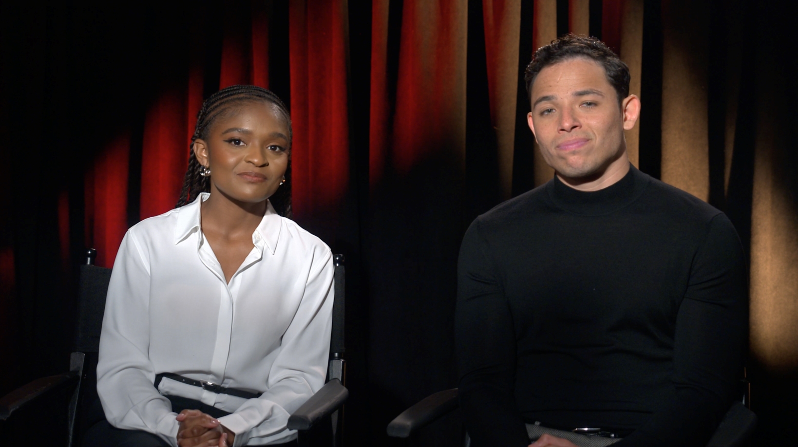 Riri Williams and Dominique Thorne, sitting side by side in front of a curtain