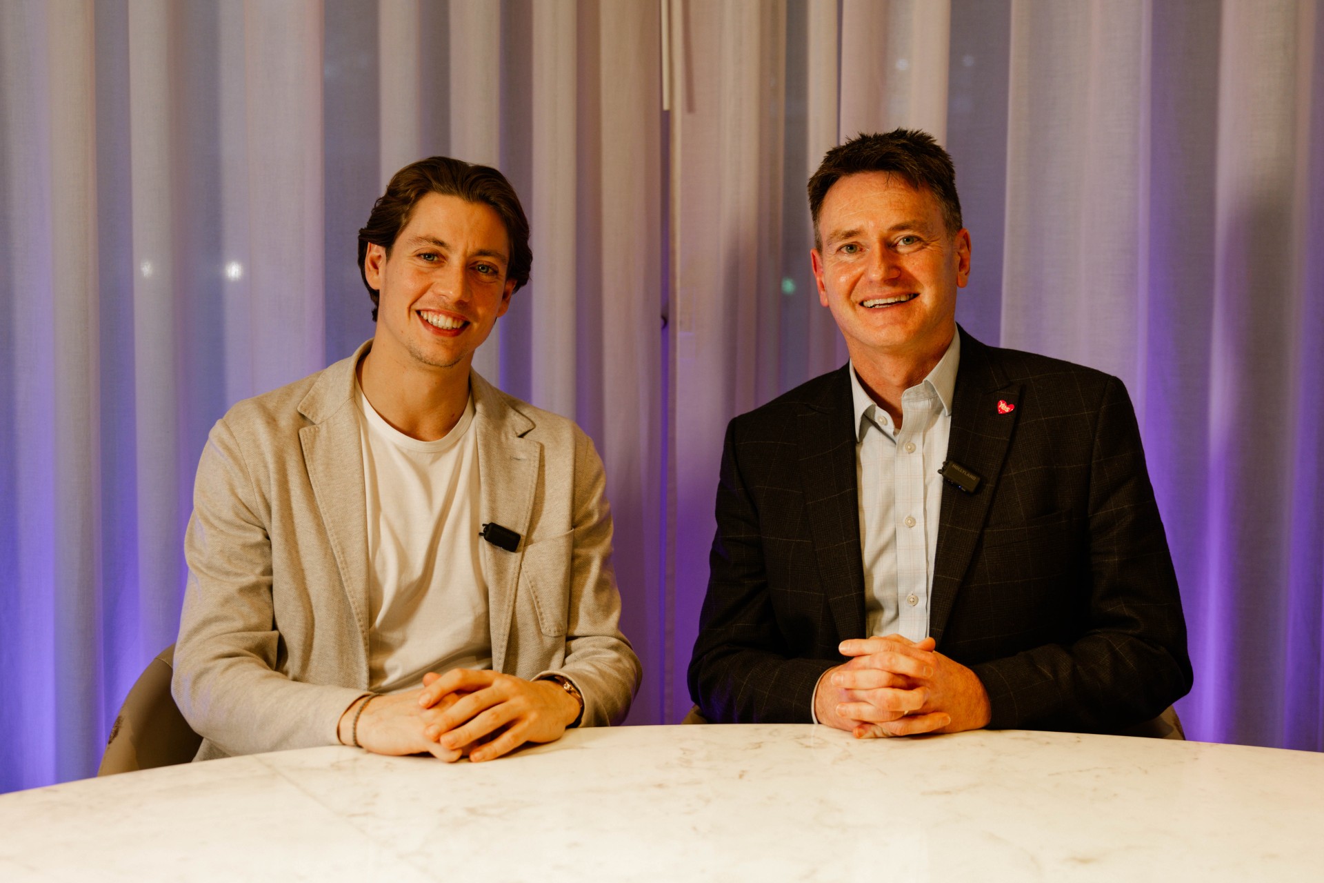 Sam Vanderpump sitting at a table with Anthony Clarkson, Director of Organ and Tissue Donation and Transplantation