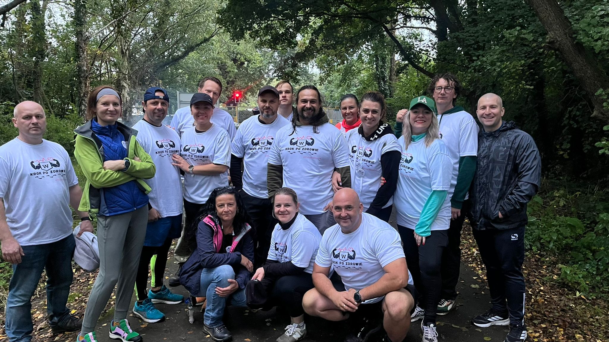 Wiktor walking with a group of friends to raise awareness for blood donation