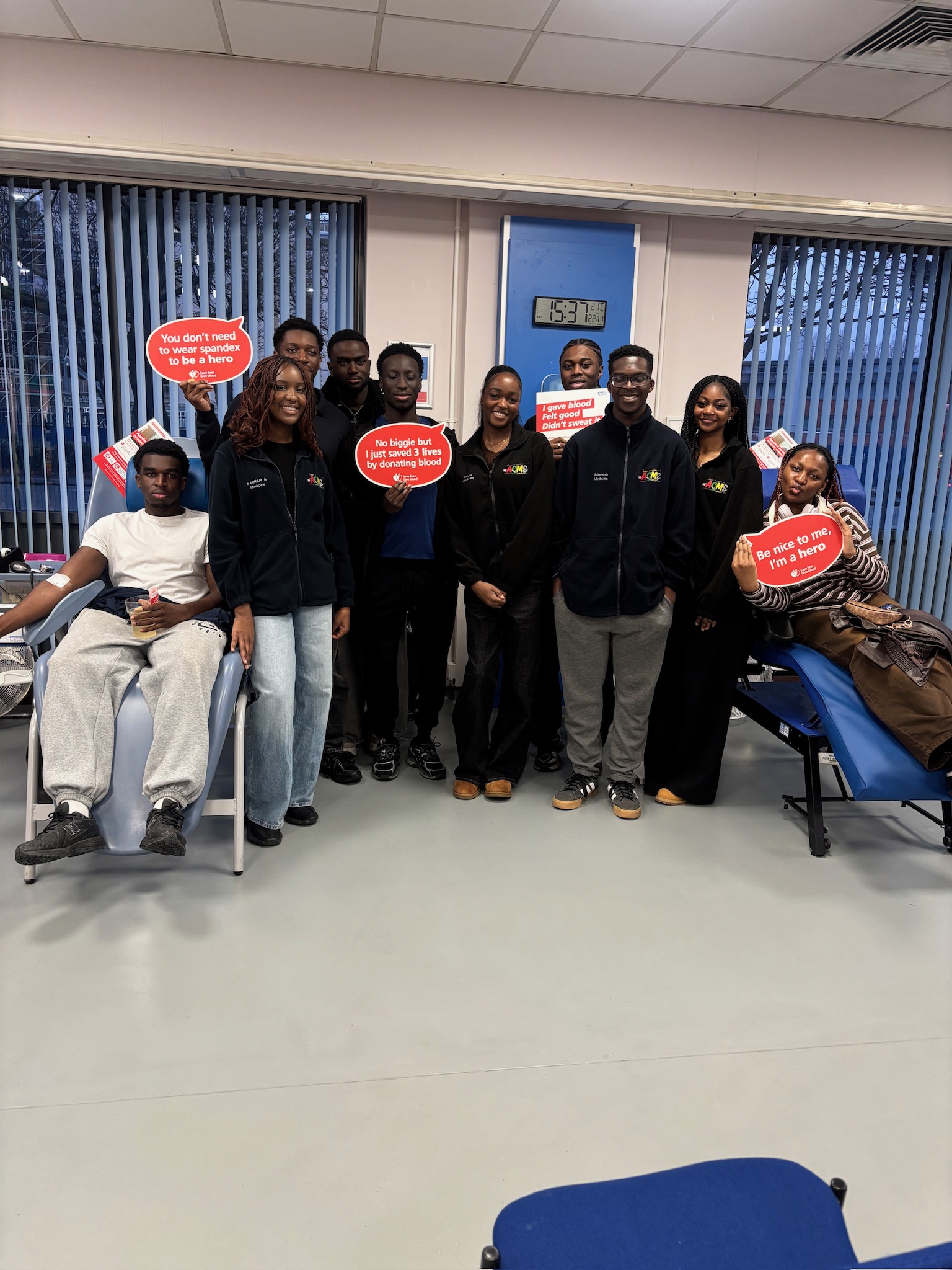 Members of the  University of Manchester African Caribbean Medical Society (ACMS) donating at Plymouth Grove