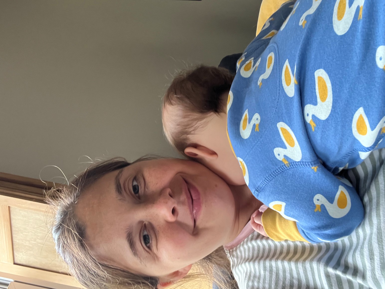 Jessica, holding her baby son