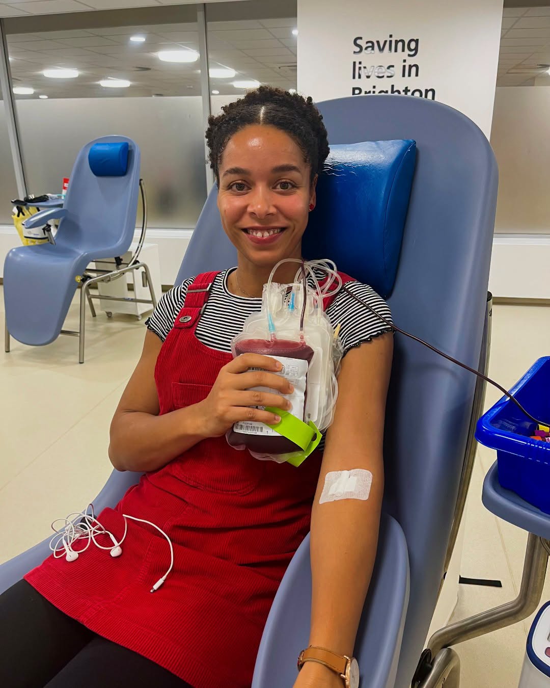 Blood donor Liliana holding a blood bag