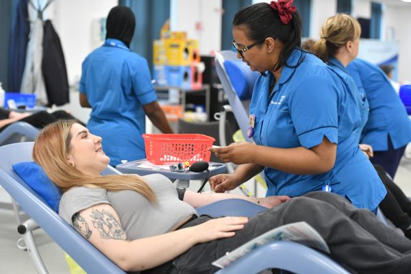 A donor giving blood