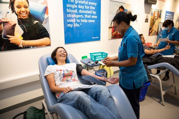 A donor smiles with a donor carer