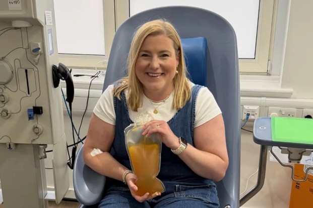 Lauren with a bag of her donated plasma