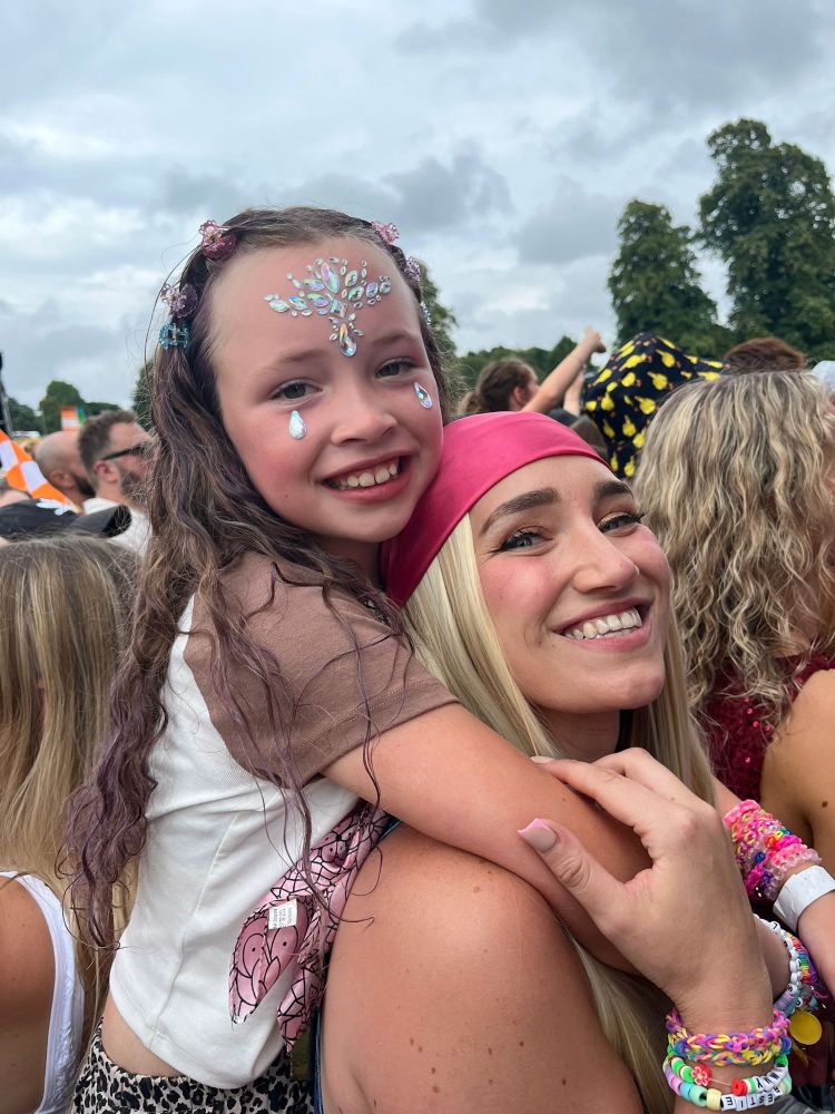 Ellie at a music festival with her daughter