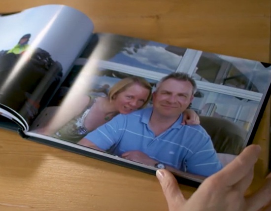 An image of Karen with her arm around husband Mark in a photo album